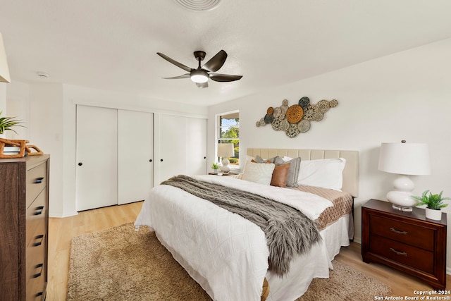 bedroom featuring light wood-type flooring and ceiling fan