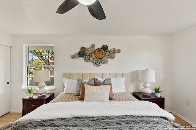 bedroom featuring light hardwood / wood-style flooring and ceiling fan