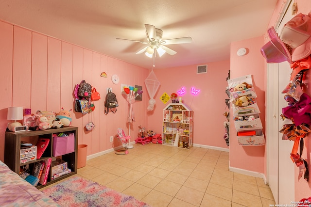 tiled bedroom with ceiling fan