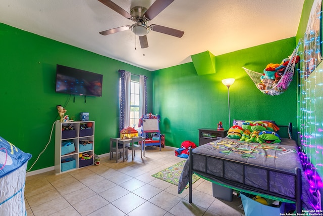 bedroom featuring tile patterned floors and ceiling fan