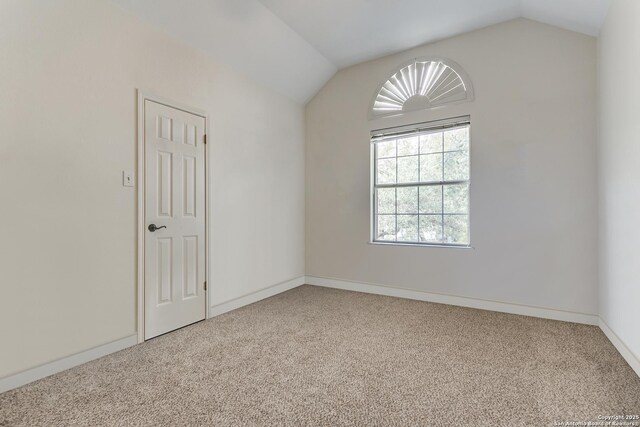 2210 Postoak Ct, San Antonio, TX 78248 - spare room featuring carpet, vaulted ceiling, and baseboards