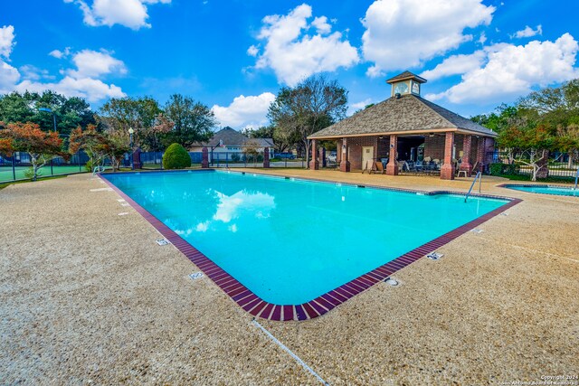 view of pool with a patio area and a gazebo