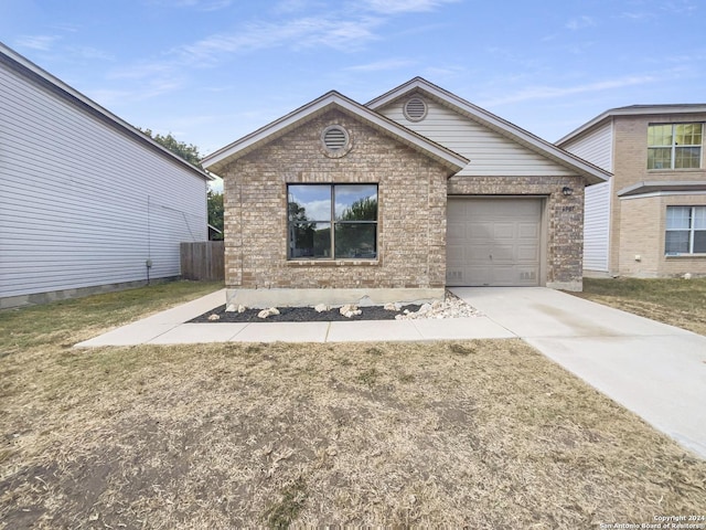 view of front of house with concrete driveway, an attached garage, and brick siding