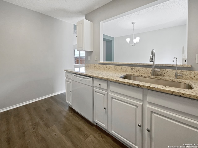 kitchen featuring dark wood-type flooring, dishwasher, white cabinets, light stone countertops, and decorative light fixtures