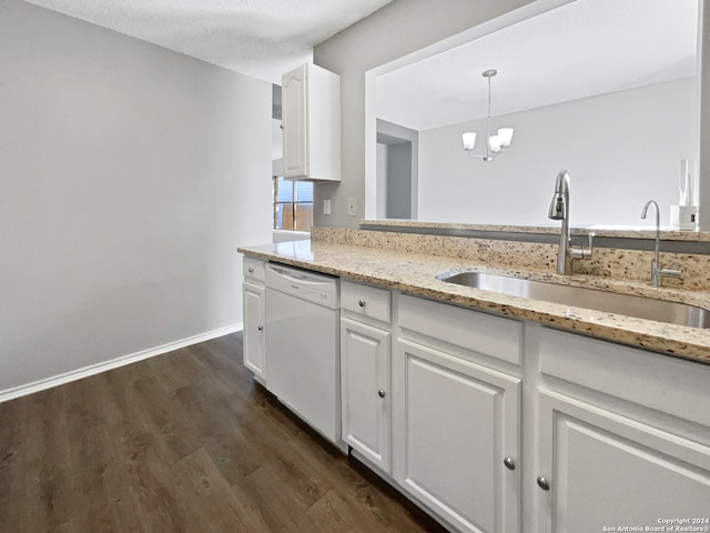 kitchen featuring white cabinets, sink, decorative light fixtures, and dishwasher