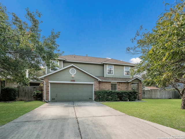 view of front property featuring a garage and a front lawn