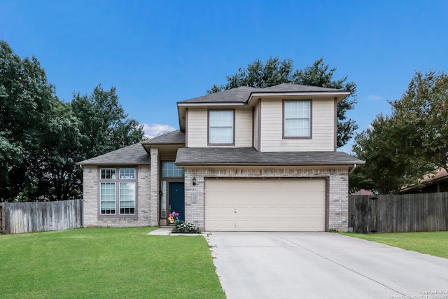 view of front facade featuring a front yard and a garage