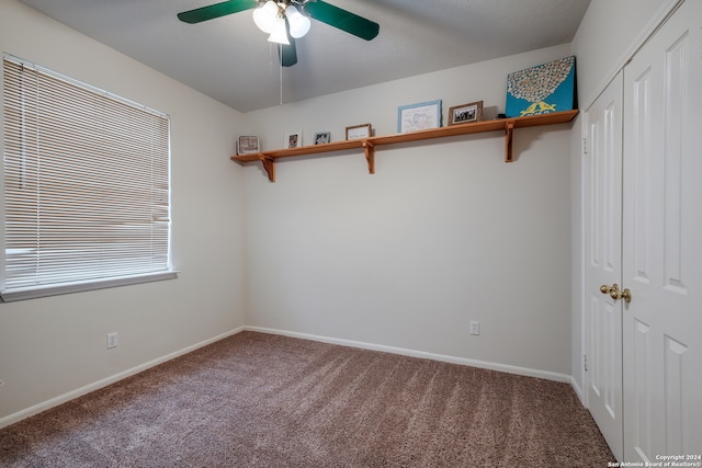 spare room featuring ceiling fan and carpet flooring