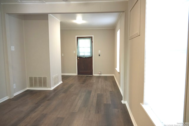 entryway featuring dark hardwood / wood-style floors and ornamental molding