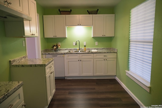 kitchen featuring white dishwasher, white cabinetry, sink, and dark wood-type flooring