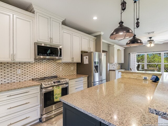 kitchen with stainless steel appliances, decorative backsplash, ceiling fan, crown molding, and pendant lighting