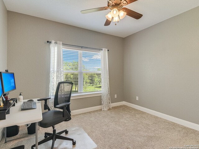 office space with light colored carpet and ceiling fan