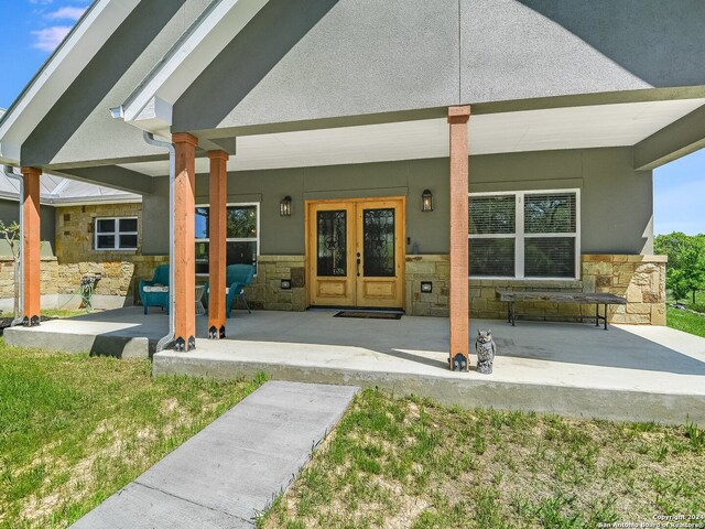 rear view of property with a patio and french doors