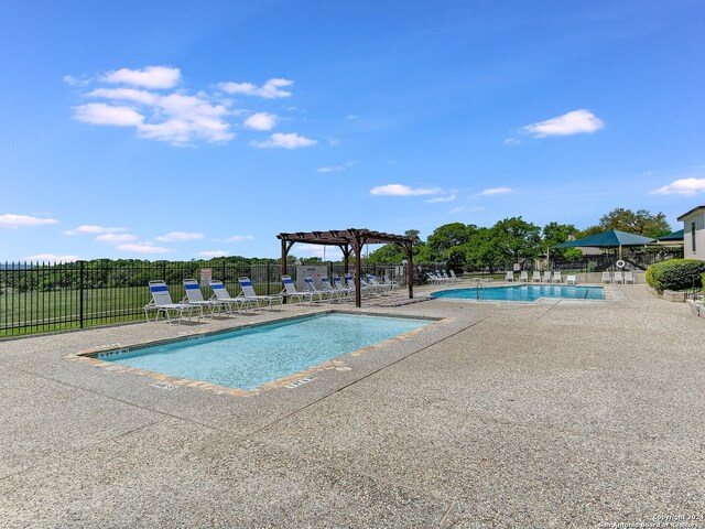 view of pool featuring a pergola and a patio area