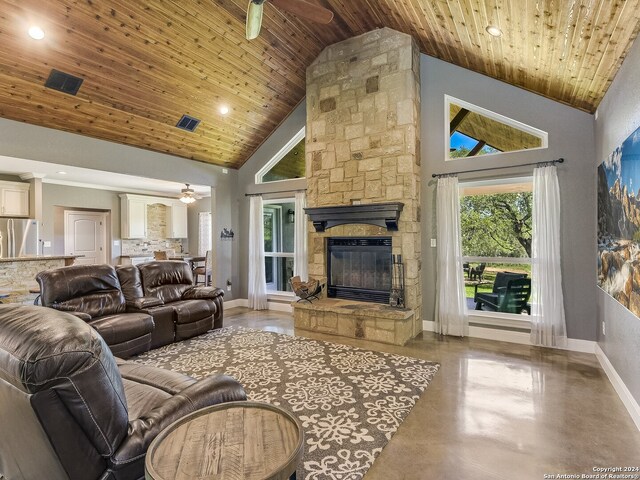 living room with a stone fireplace, high vaulted ceiling, wood ceiling, and concrete floors