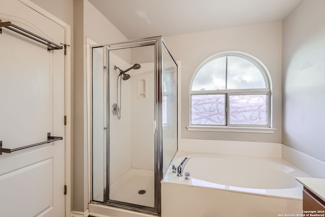 bathroom featuring vanity and shower with separate bathtub