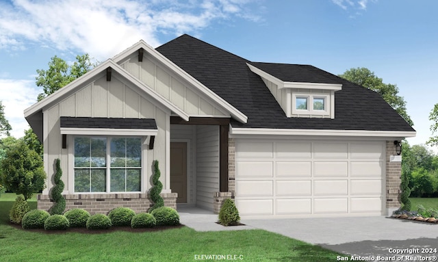 view of front of house featuring a garage and a front yard