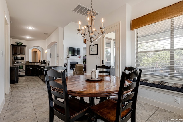 dining space featuring an inviting chandelier