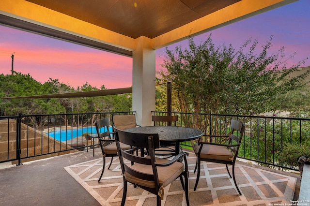 view of balcony at dusk