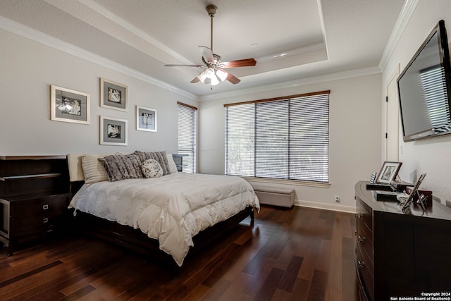 bedroom with dark wood-type flooring, ceiling fan, and crown molding