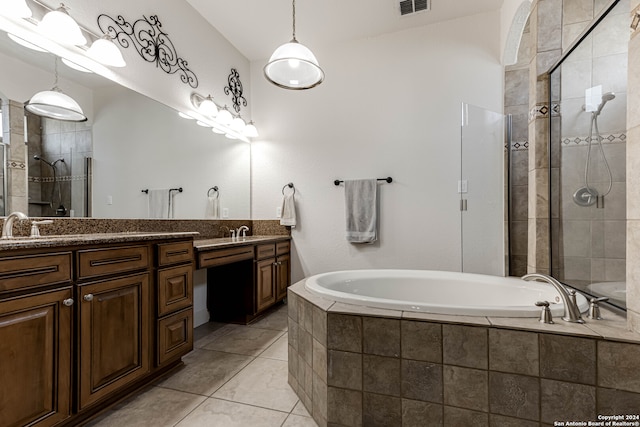 bathroom featuring separate shower and tub, vanity, and tile patterned floors