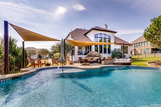 view of swimming pool with outdoor lounge area, a yard, and a patio area