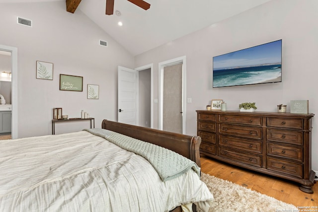 bedroom with light hardwood / wood-style floors, ensuite bathroom, ceiling fan, beam ceiling, and high vaulted ceiling