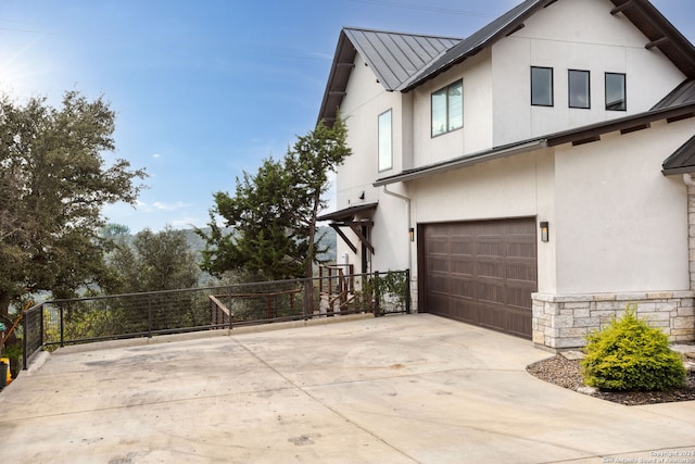 view of side of property with a garage