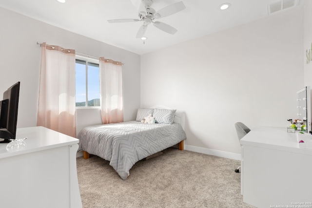 carpeted bedroom featuring ceiling fan