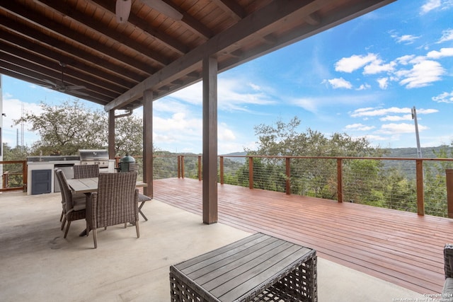 wooden terrace with area for grilling