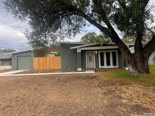 view of front of home featuring a garage and a porch