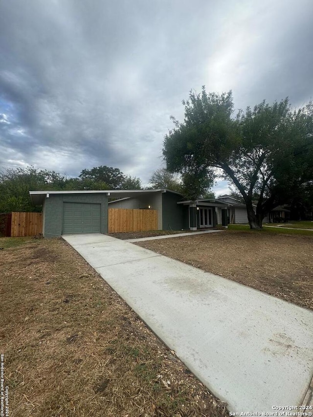 ranch-style house featuring a garage