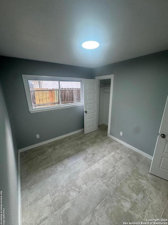 unfurnished bedroom featuring a closet