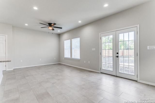 interior space with french doors, a healthy amount of sunlight, ceiling fan, and light tile patterned flooring