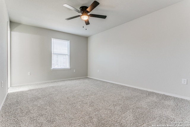 empty room with carpet and ceiling fan