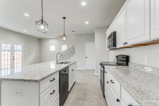 kitchen featuring black appliances, sink, an island with sink, white cabinetry, and decorative light fixtures