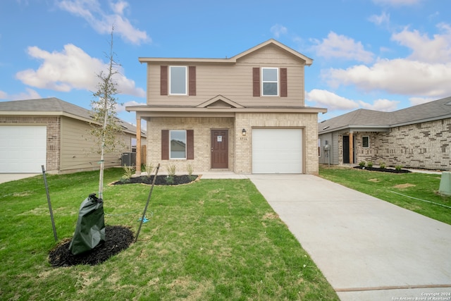 front facade featuring a garage and a front lawn