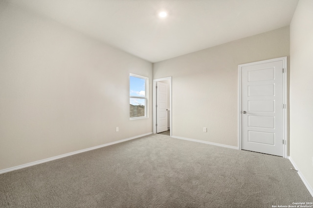 spare room featuring carpet floors