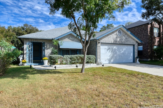 ranch-style house with a garage and a front yard