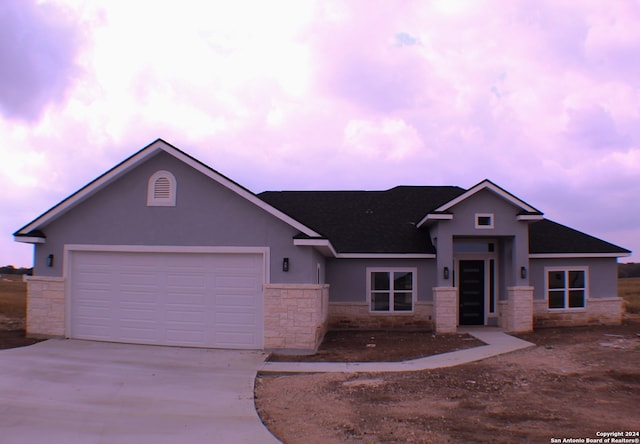 view of front of property featuring a garage