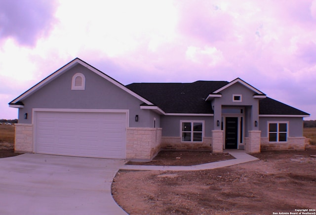 view of front of home with a garage