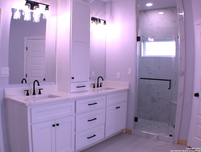 bathroom with vanity and walk in shower