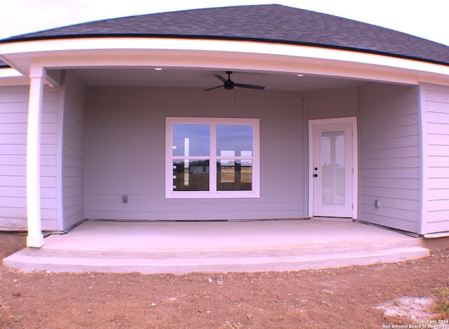 doorway to property featuring ceiling fan and a patio