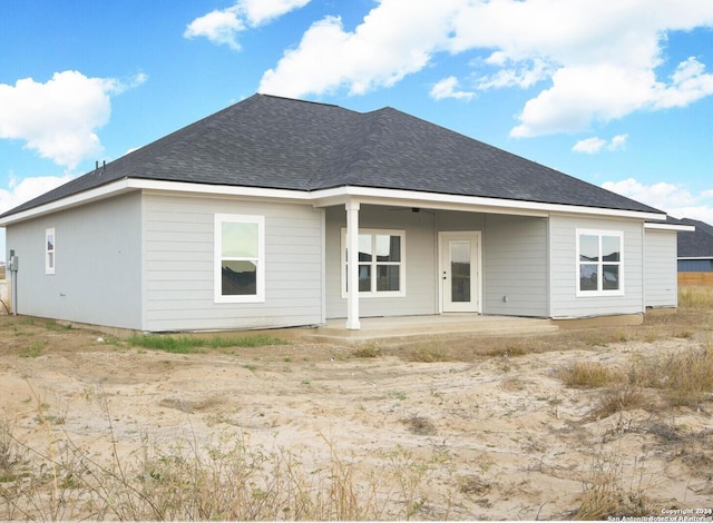 back of house with a patio area