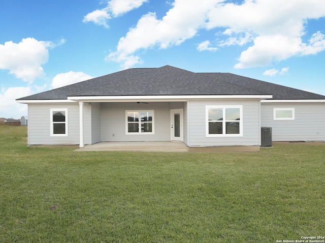 rear view of property with central AC, a yard, a patio, and ceiling fan