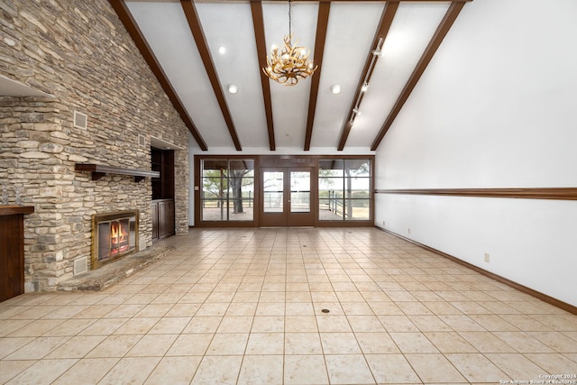 unfurnished living room featuring a stone fireplace, a chandelier, light tile patterned floors, high vaulted ceiling, and beamed ceiling