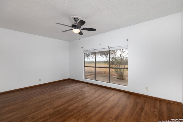 spare room featuring hardwood / wood-style flooring, ceiling fan, and a textured ceiling