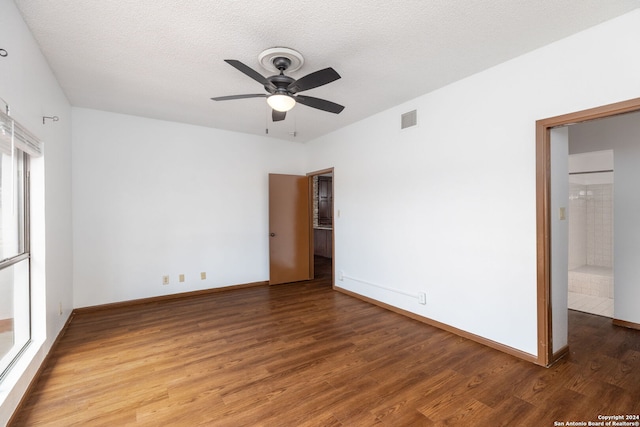 spare room featuring a textured ceiling, hardwood / wood-style floors, and ceiling fan