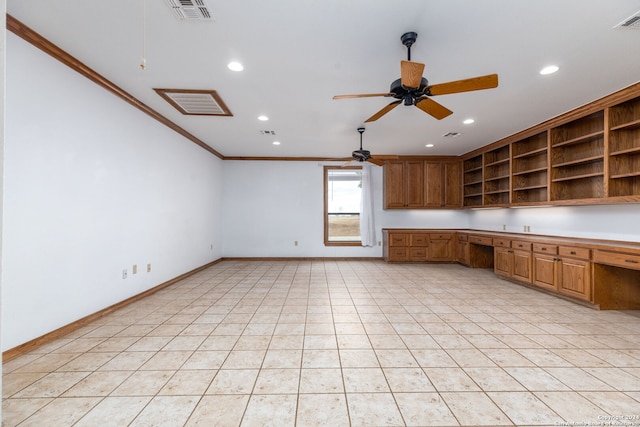 kitchen featuring light tile patterned flooring, built in desk, ceiling fan, and crown molding