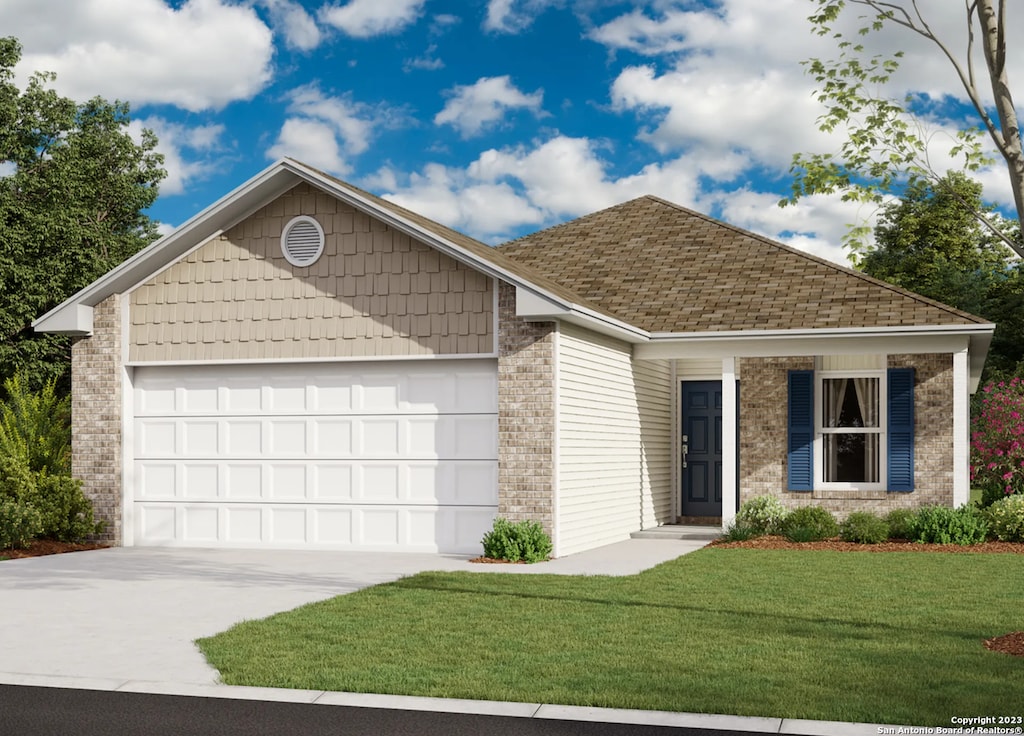 view of front of property with a garage and a front lawn